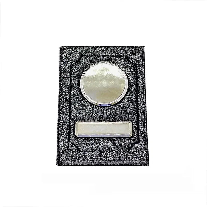 Black synthetic leather passport case with expandable design and aluminum lenses on a plain background