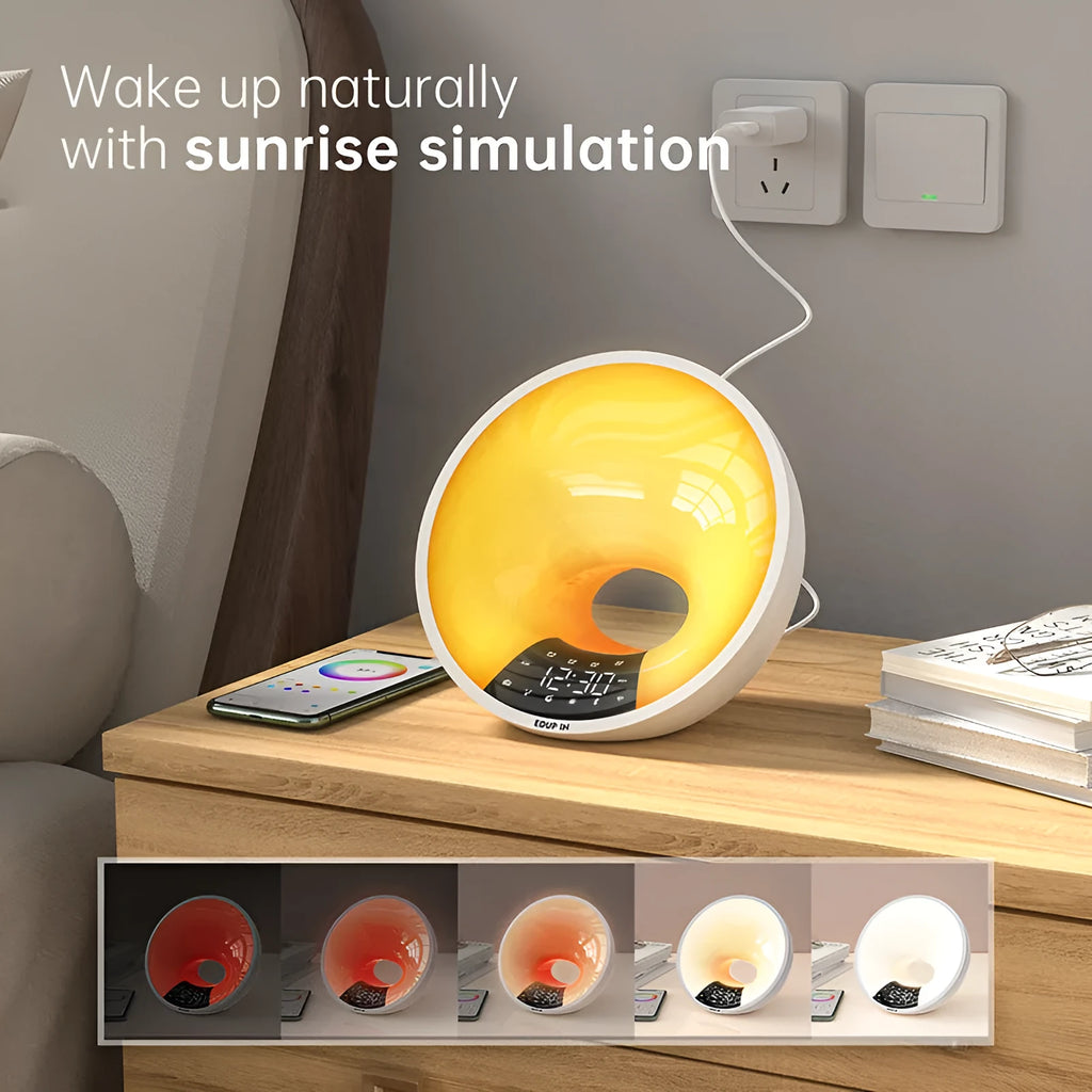 White WiFi sunrise alarm clock with dual alarm and FM radio on bedside table
