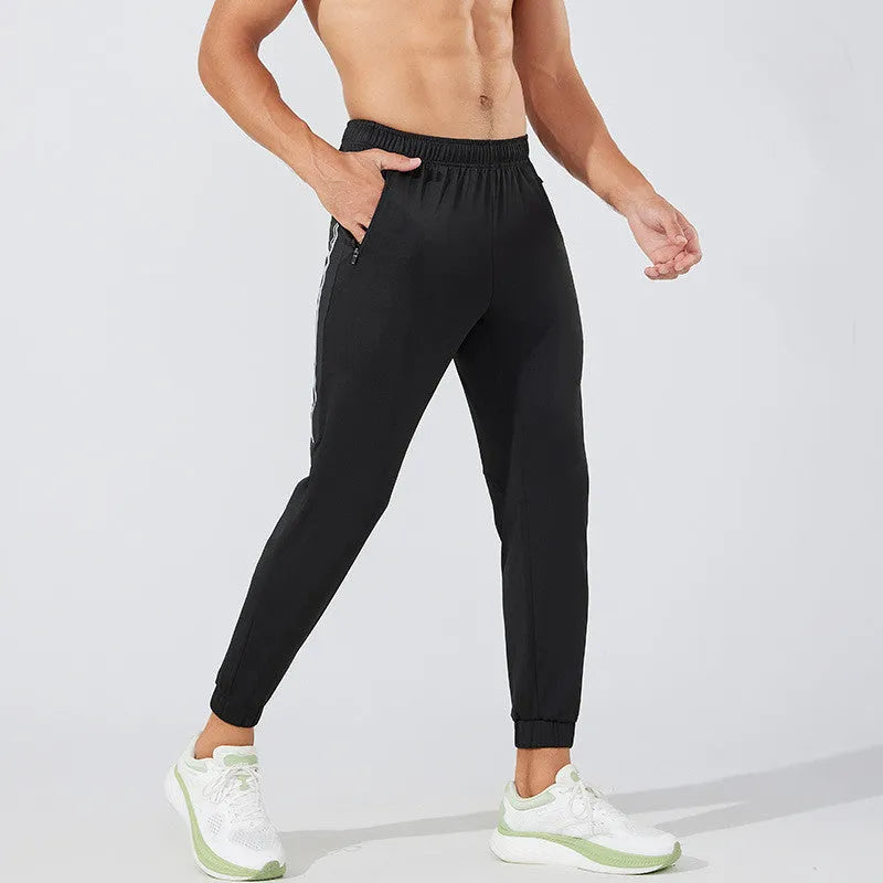 Men's black polyester running trousers with mid waist fit and full-length legs