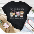 Black loose-fit cotton summer T-shirt with short sleeves and a round neck on a hanger.