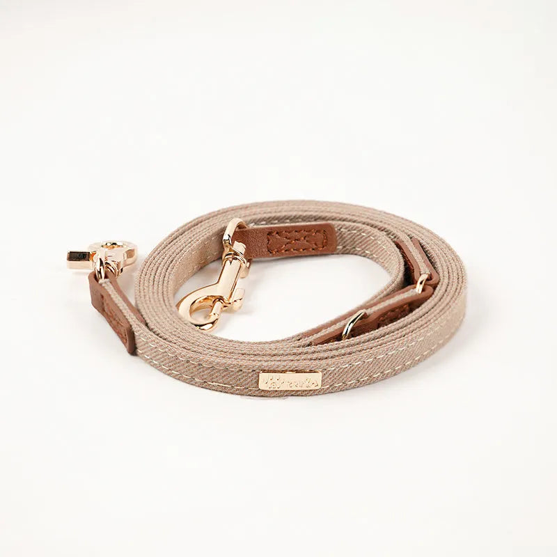 Anti-lost nameplate mohair dog collar in cement gray with matching hand holding rope for Shiba Inu