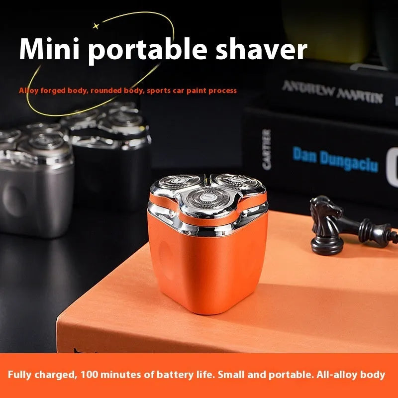 Mini three-head electric shaver rechargeable with 60-day battery life, fully washable, available in lava orange