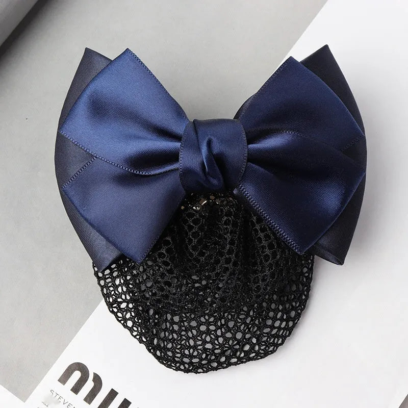 Professional bow hairnet headdress with integrated work plate clip and mesh storage pocket