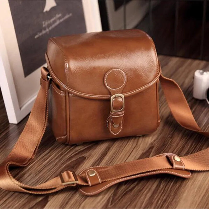Fashion single shoulder SLR camera liner bag in PU leather, small size, dark coffee colour, for home storage.