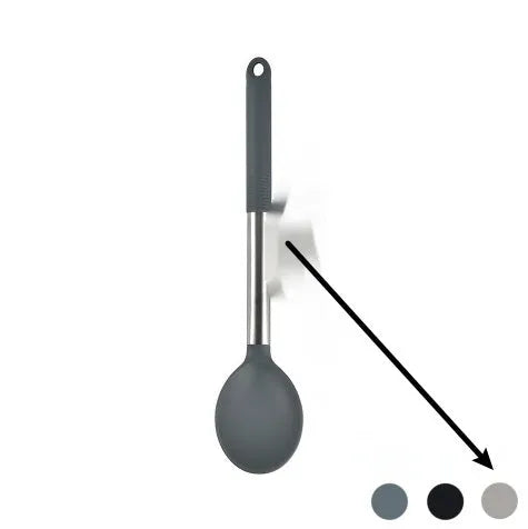 Silicone kitchen utensil set with twelve tools in a rotating white storage caddy on a counter.