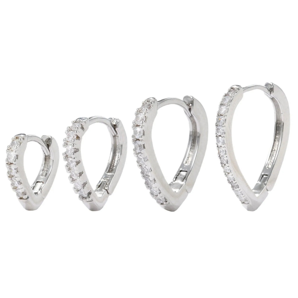 A geometric heart-shaped gold ear clip for women on a white background.