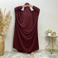 Middle Eastern Dubai style split abaya dress for women in Nida fabric, loose fit, long sleeves, available in multiple colours.