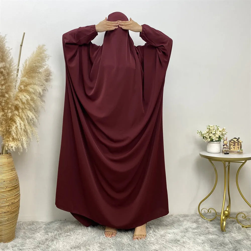 Middle Eastern Dubai style split abaya dress for women in Nida fabric, loose fit, long sleeves, available in multiple colours.