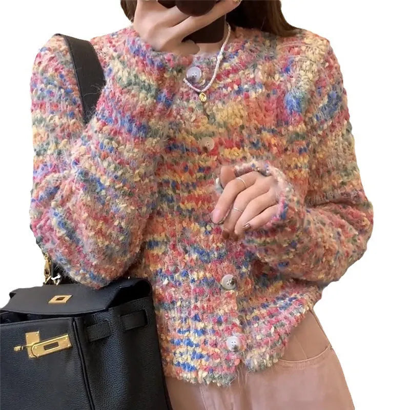 Pink and green rainbow pattern knitted cardigan on a hanger, showing slim fit and regular sleeves.