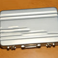 Aluminium alloy card holder in silver, showing its slim 16mm thickness and compact size.
