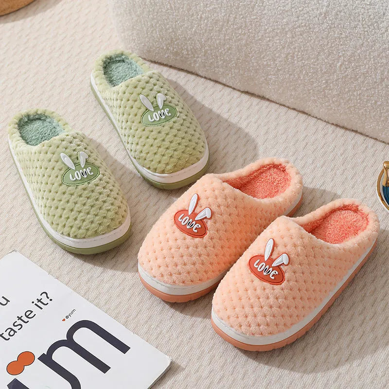 Women's rabbit plaid design winter slippers with artificial fur upper and thick rubber sole.