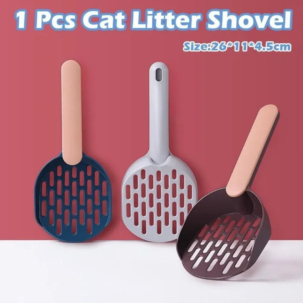 Blue plastic cat litter shovel scoop for cleaning litter boxes, shown next to a litter tray.
