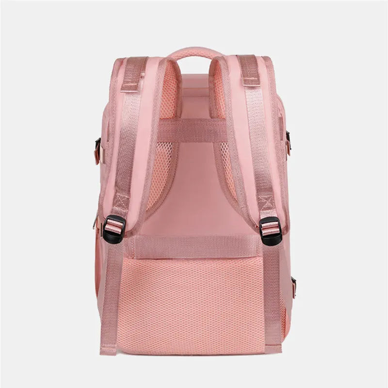 Large purple travel backpack with multiple compartments open, showing laptop sleeve and organiser pockets.