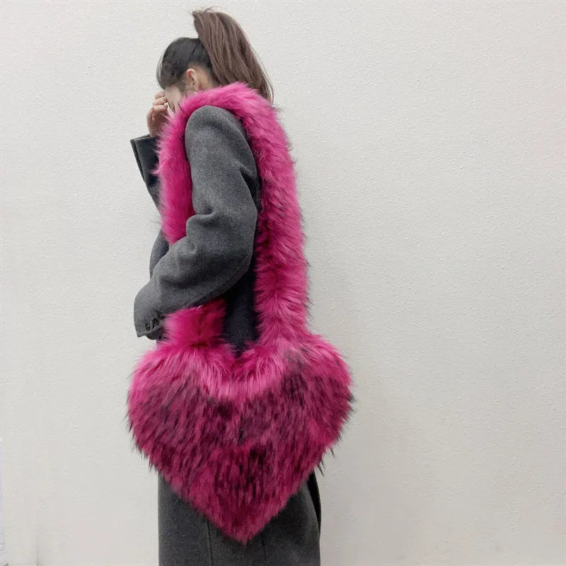 Women winter fleece heart shape crossbody bag with plush exterior, tassel detail, and large capacity