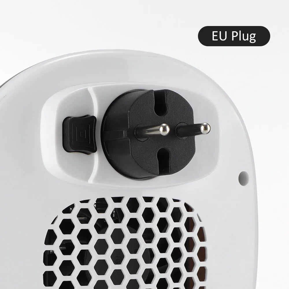 White ceramic heating electric heater with remote control on a table.