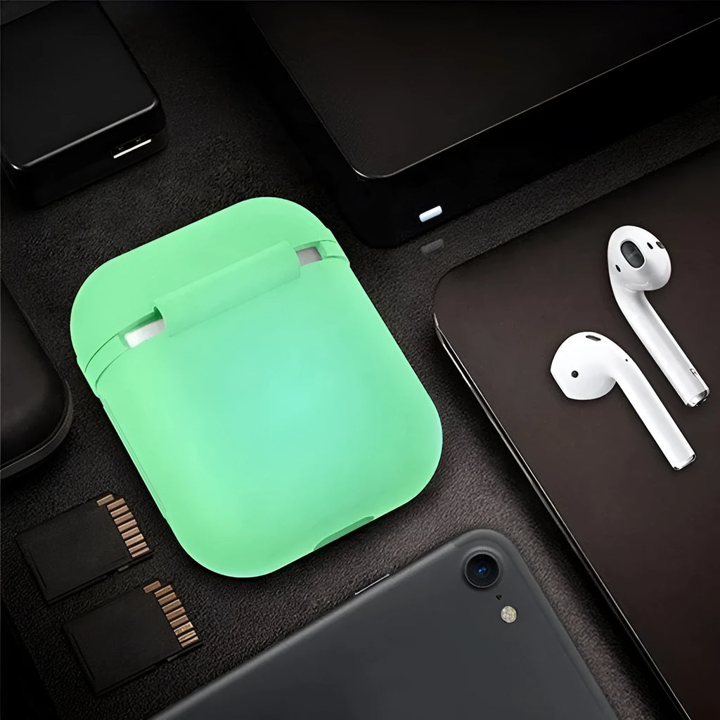 Glow-in-the-dark silicone flip cover case for Apple AirPods charging case on a dark background