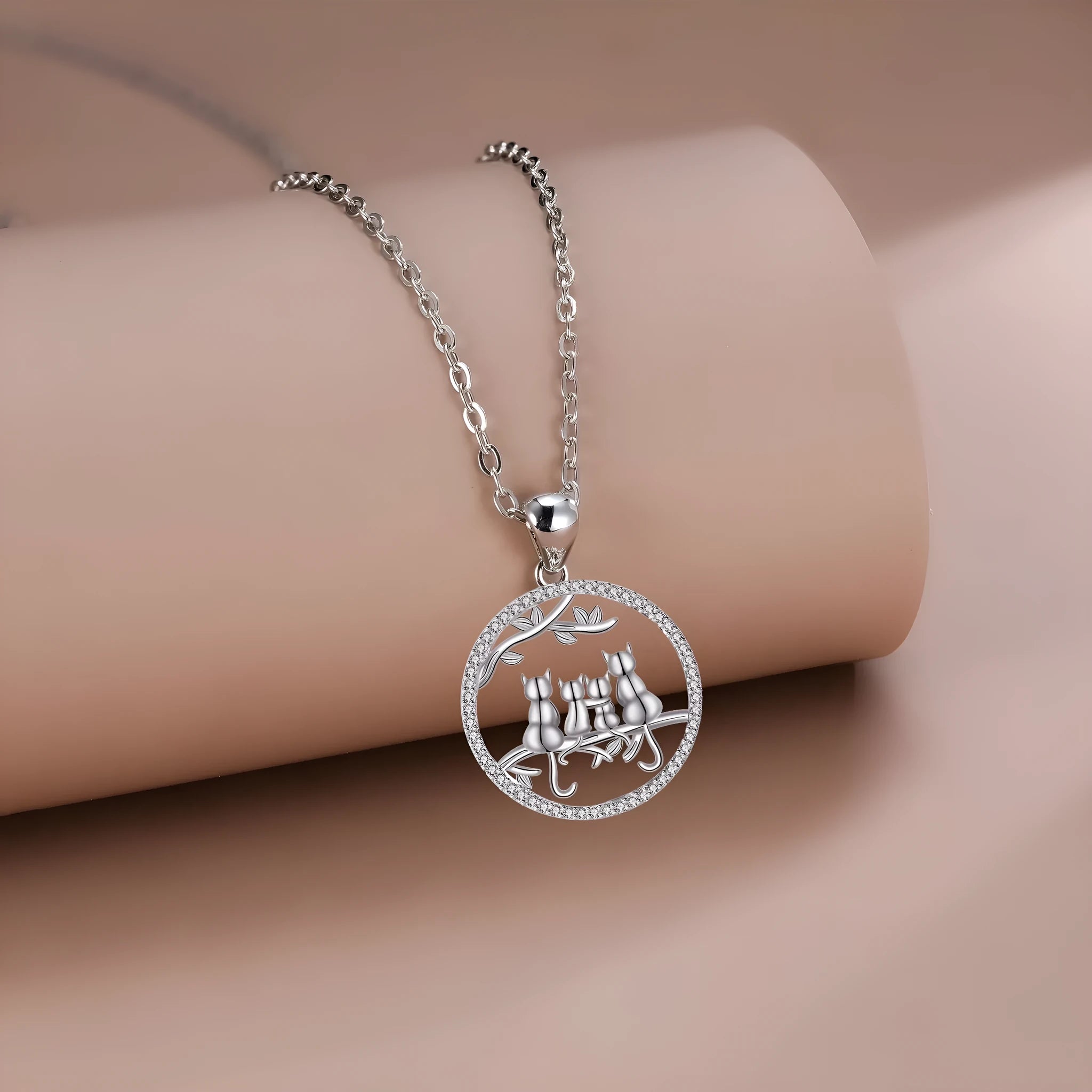 Women's copper necklace with four kitten pendants on cross chain design