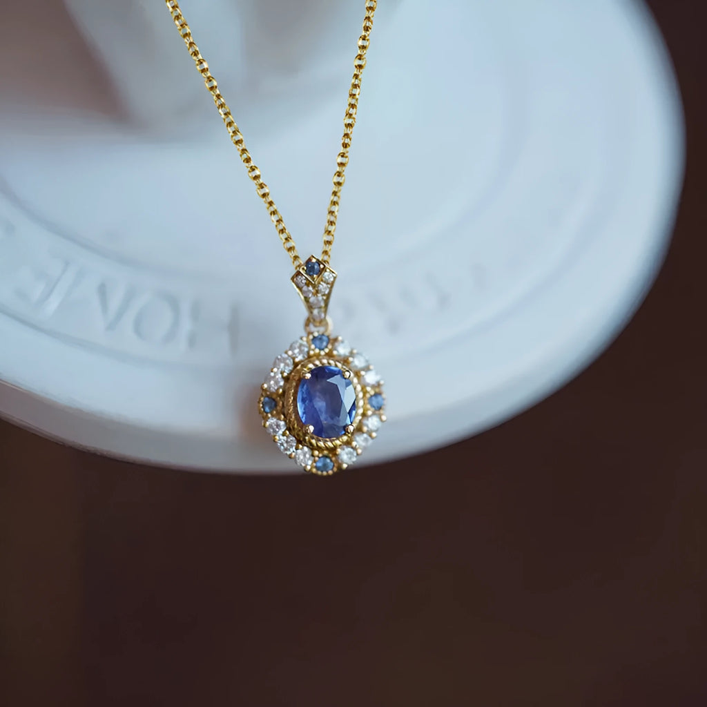 Yellow gold royal style necklace with zircon and gemstone pendant on an adjustable copper box chain.