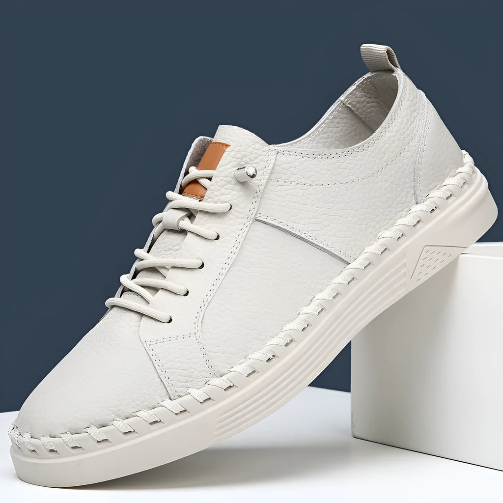Men's beige and black round toe casual sneakers made from first layer cowhide with visible stitching.