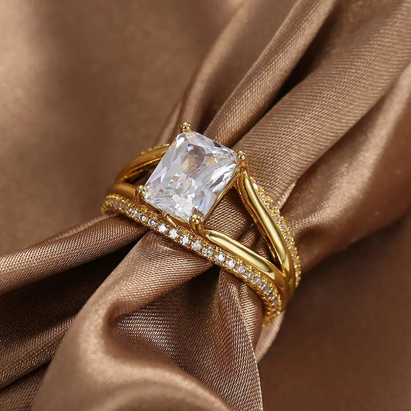 Women's geometric gold ring with square zircon centrepiece showing clean lines and electroplated finish