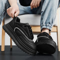 Unisex casual leather trainers with a thick platform sole in black, white, and khaki colour options.