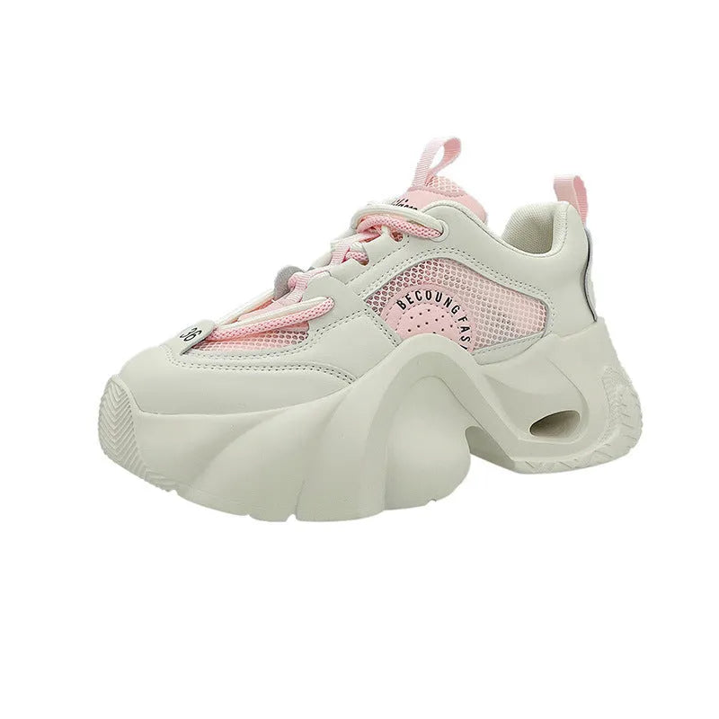 Women's beige casual sneakers with cross straps, thick sole, and mesh lining on a white background.