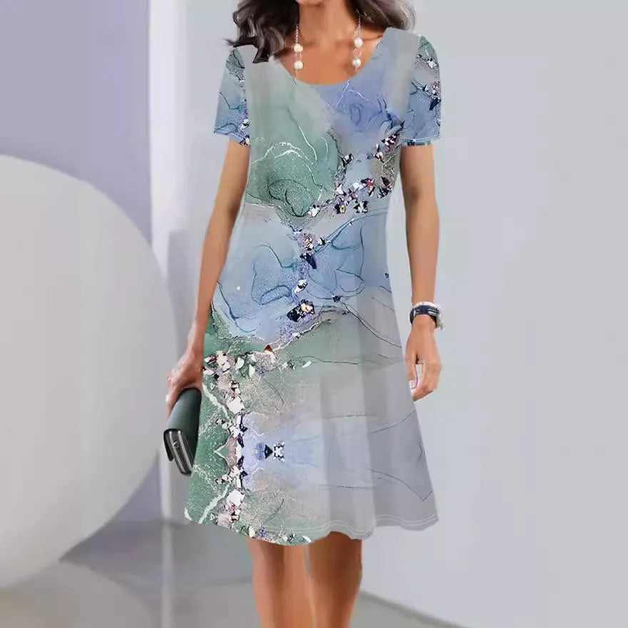 Women's floral print midi dress with short sleeves and a round neckline, shown in an A-line silhouette.