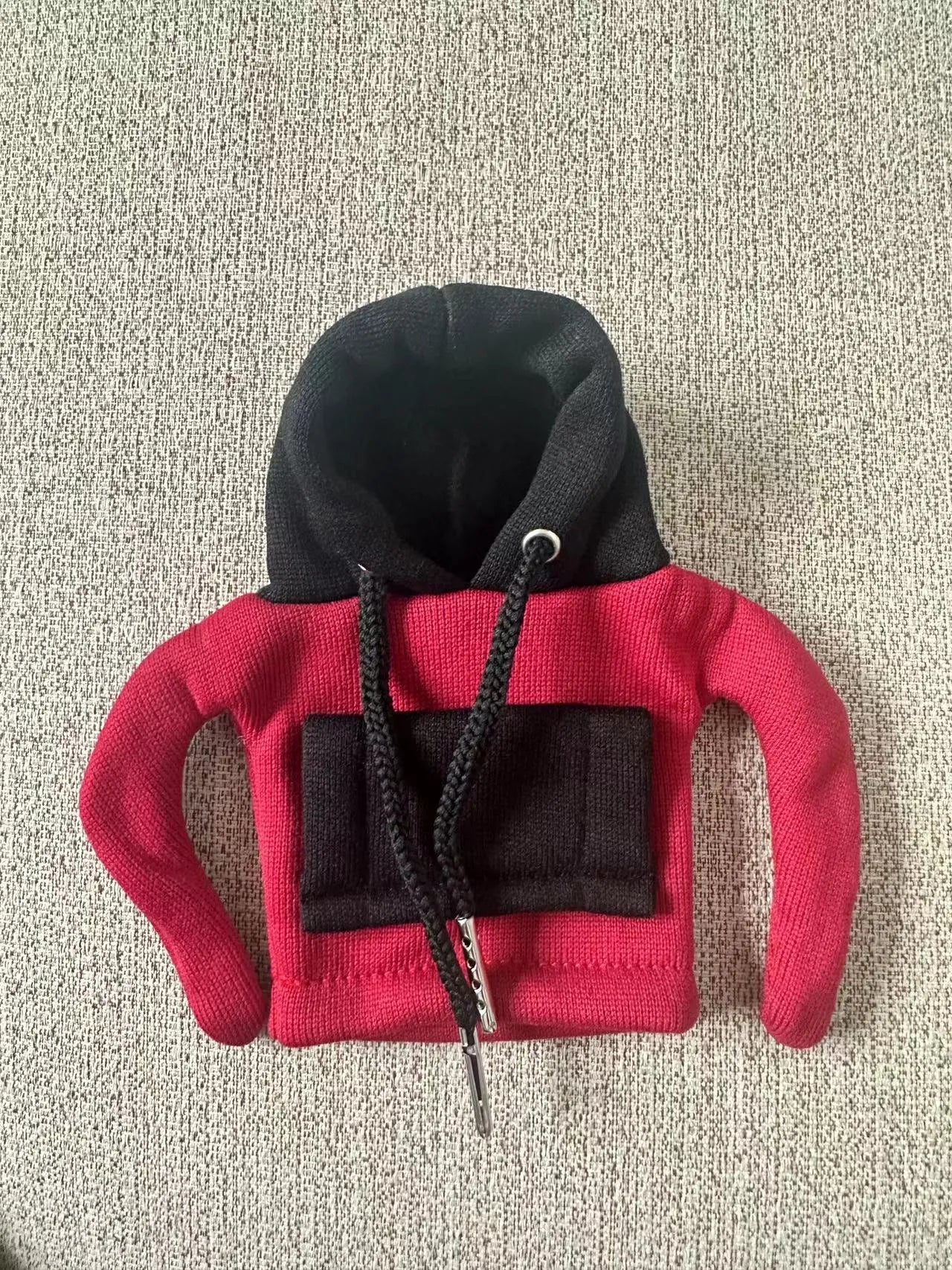 Polyester car gear lever hooded cover in red and white colour scheme measuring 12x13cm