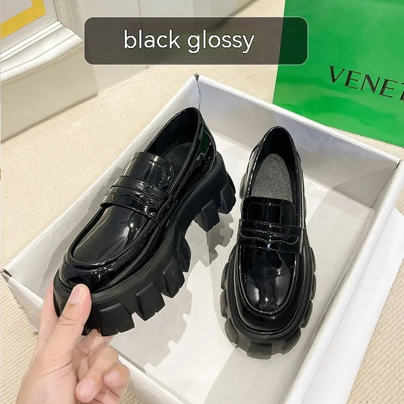 British style wide fit loafers in patent leather and matte finishes on a muffin base rubber sole.