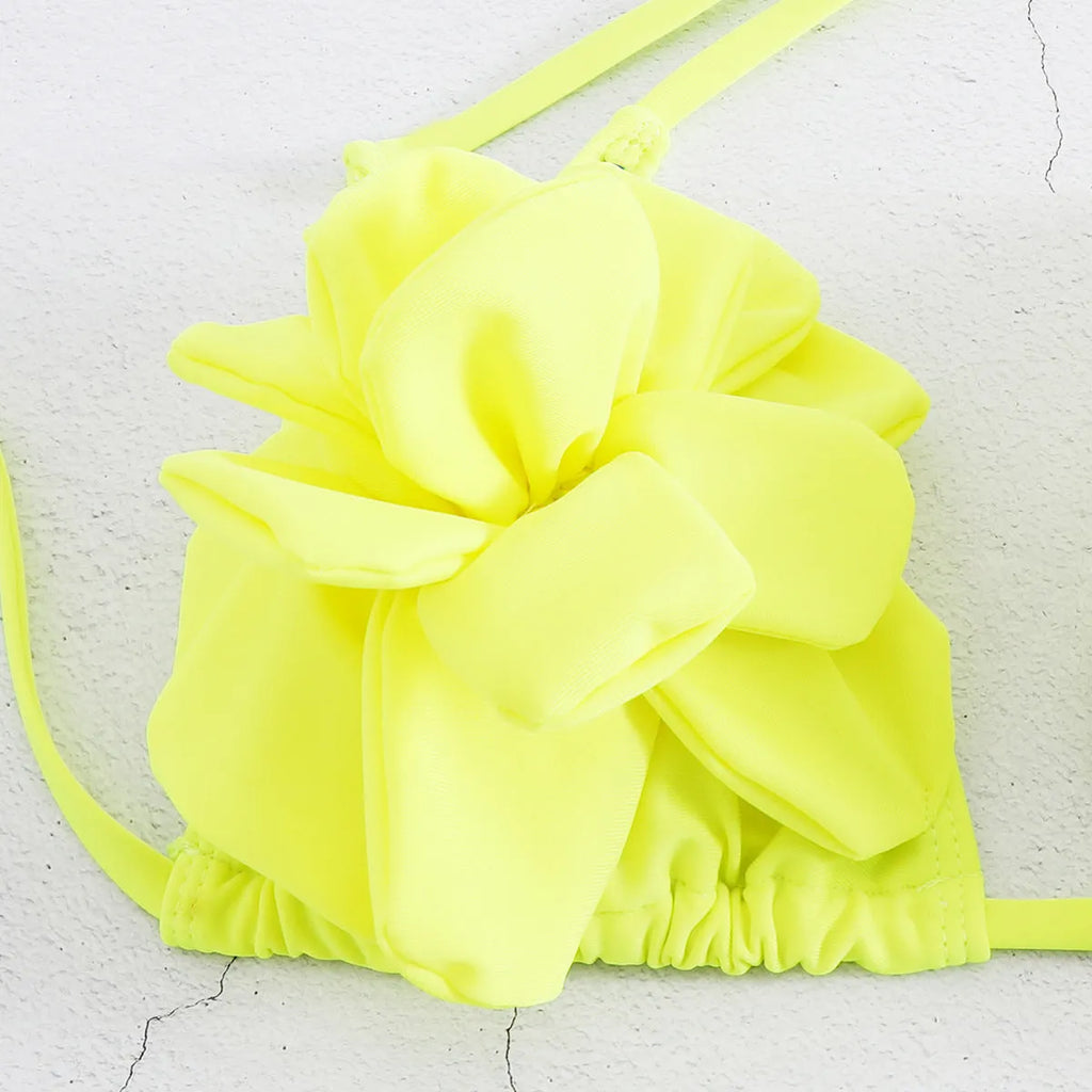 Three-dimensional 3D flower pattern on low waist bikini swimsuit in solid colour