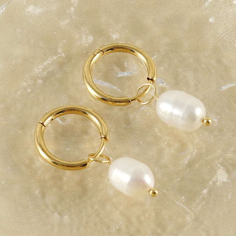 Gold geometric stainless steel earrings with a white pearl accent for women.