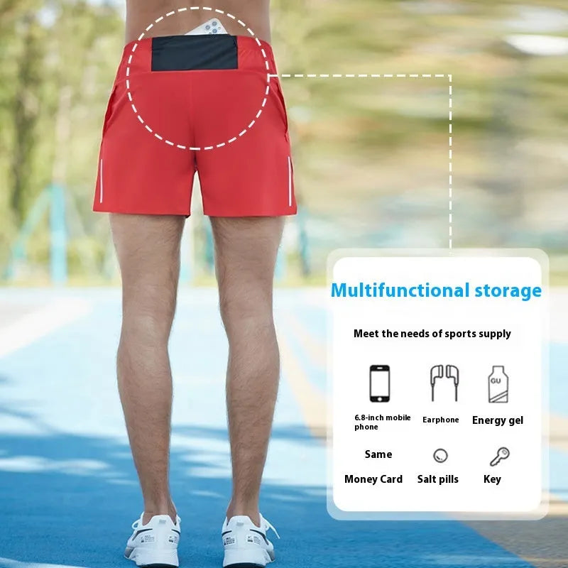Man wearing high-waisted grey off-road running shorts for cross-country running.