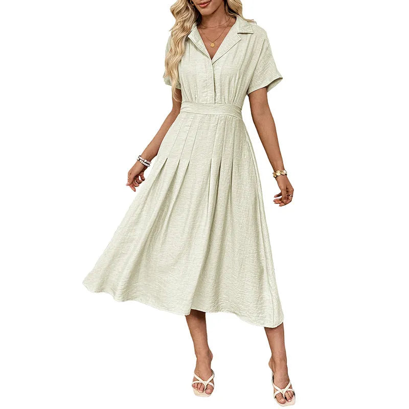 Light green commuter shirt dress with lapel collar, waist tie, and side pockets on a hanger.