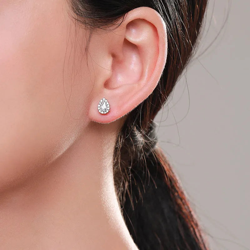Silver drop shape ear studs made from 925 sterling silver with diamond-treated finish