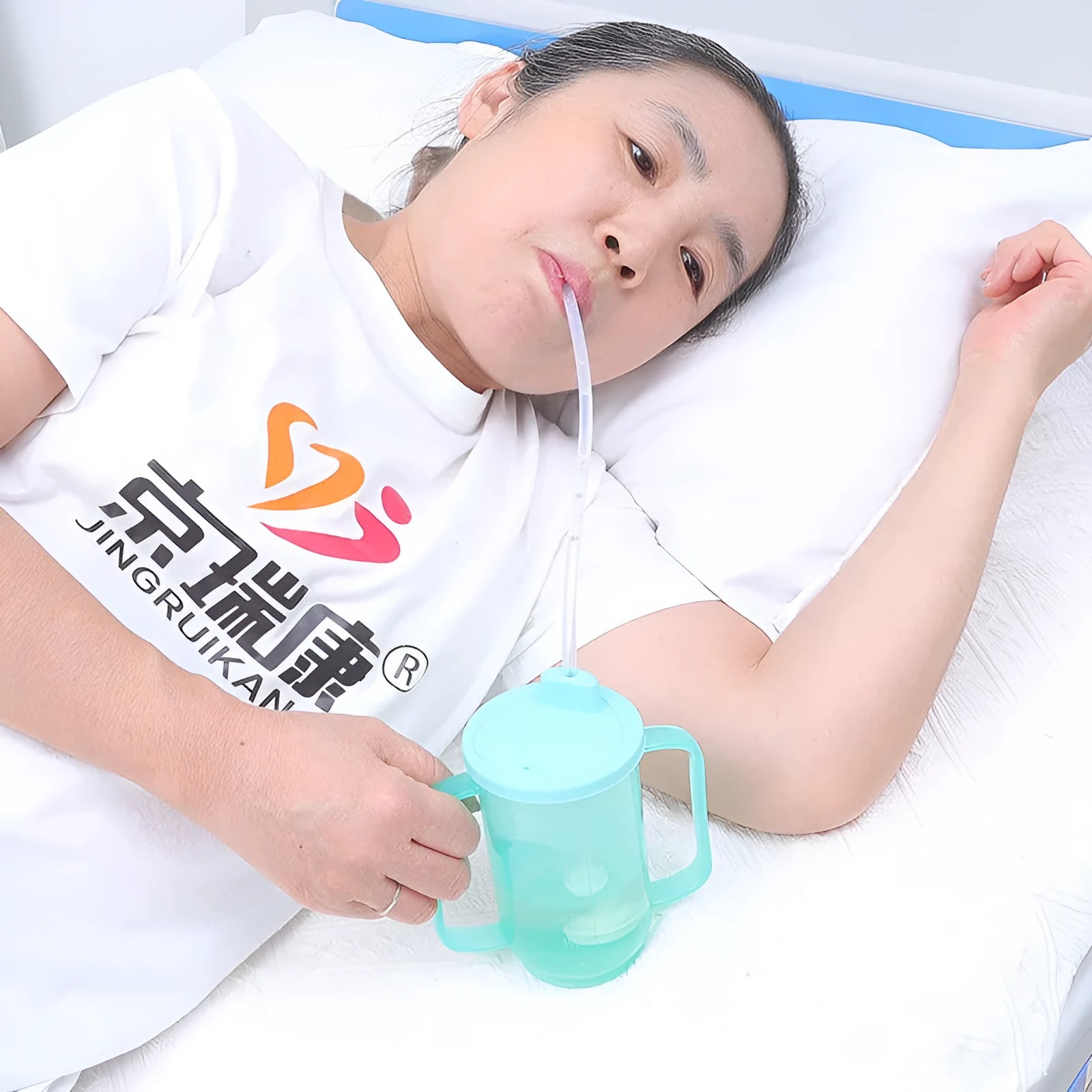 Adult care choking prevention drinking cup with handle and lid, made from white PP plastic.