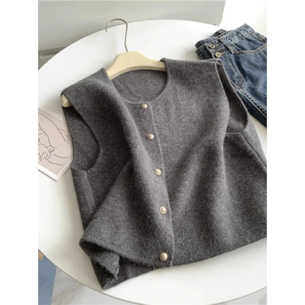 Thin polyester pullover vest with half sleeves in various colours on a hanger