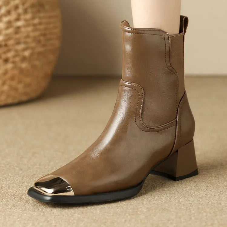 Brown women's knee-high cowhide leather Martin boots with a heel and side zipper detail.