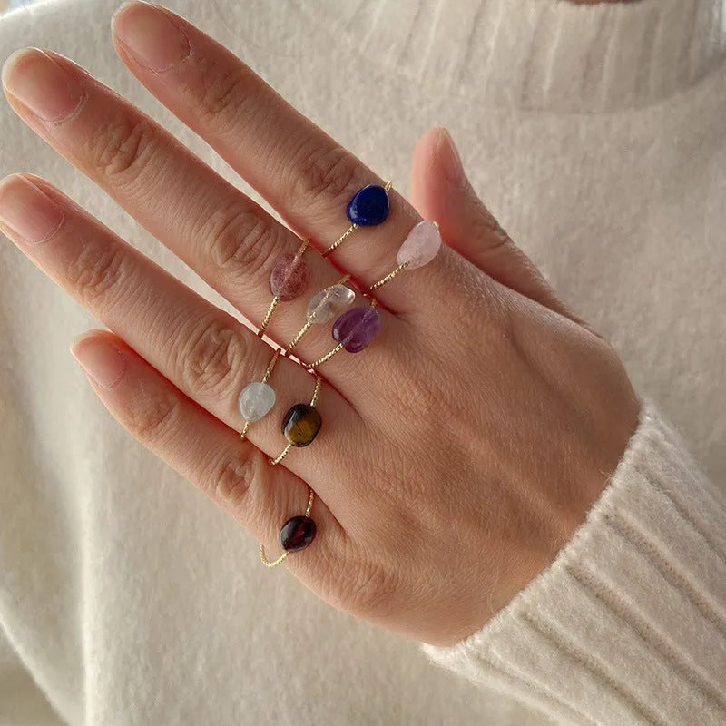 A women's ring featuring a geometric design set with a coloured agate stone.