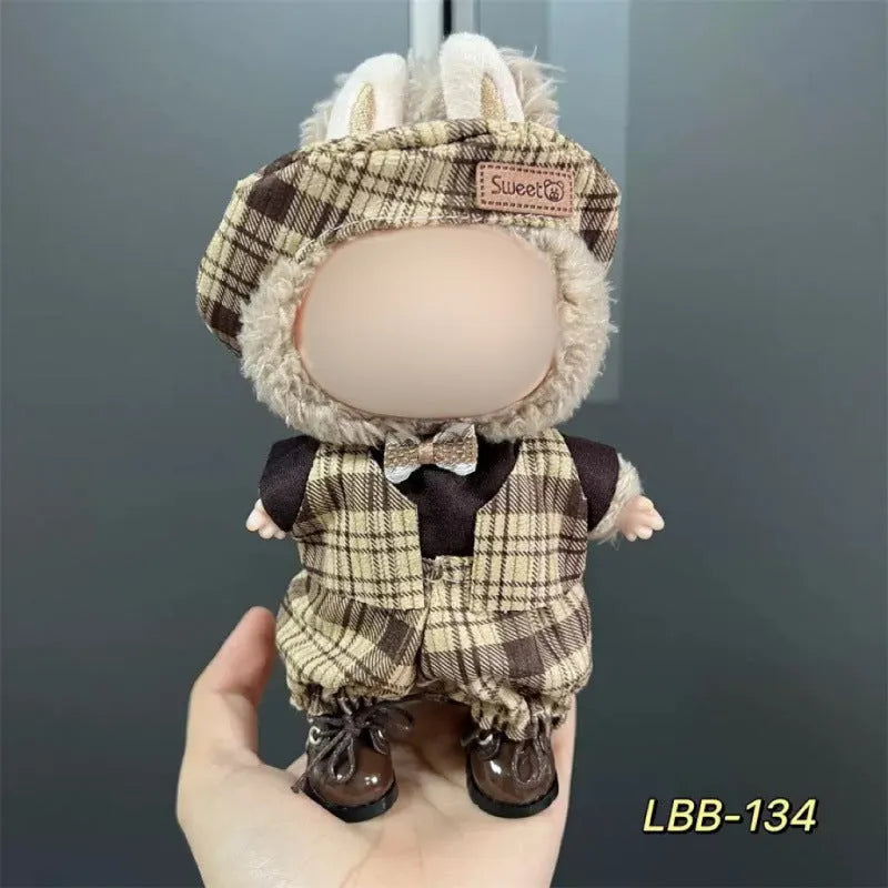 Plastic clothing outfit for a 17cm tall vinyl figure or doll on a display stand.
