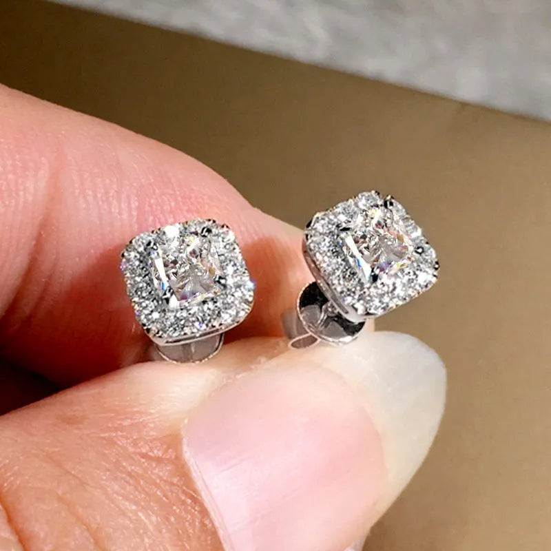 Square-cut grandmother green zircon stud earrings in electroplated copper with gold or white gold colour options.