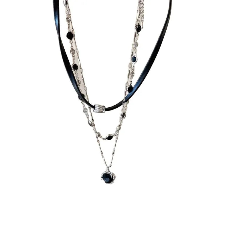 Women's multi-layer heart necklace set with alloy pendant, artificial crystal, and leather accents on an adjustable clavicle chain.