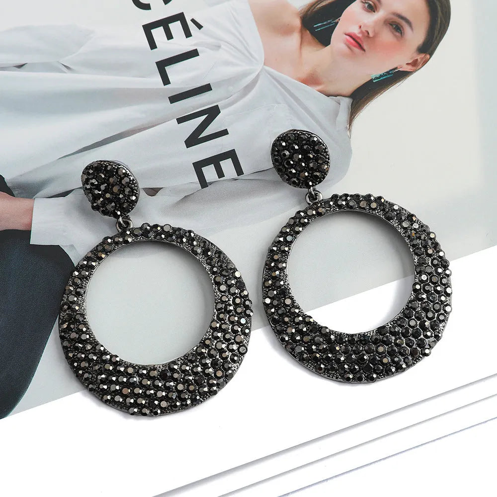 Large round pendant alloy earrings with colourful diamond cartoon design on a white background.