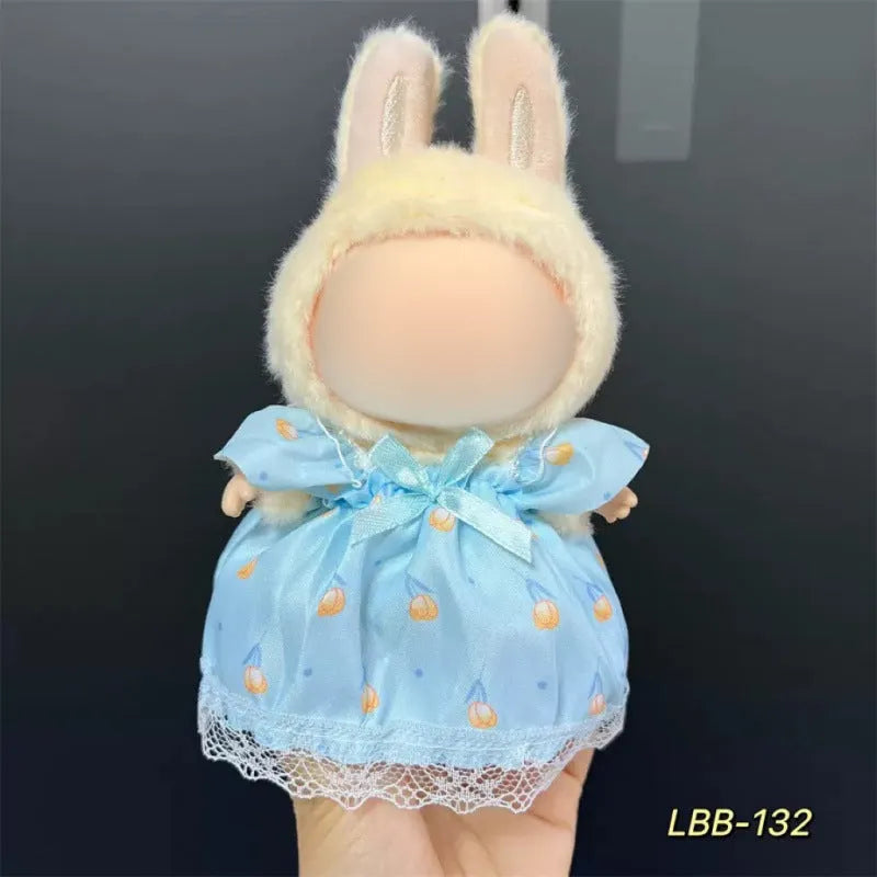 Plastic clothing outfit for a 17cm tall vinyl figure or doll on a display stand.