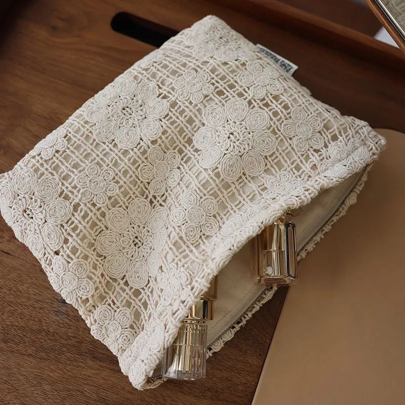 Handmade crocheted hollow flower cosmetic bag with ethnic embroidery patterns on corduroy fabric
