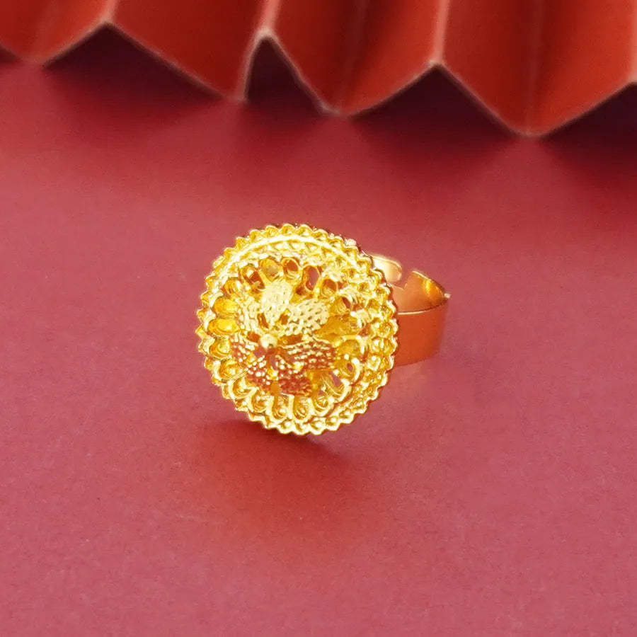 Gold-plated three-piece jewellery set with floral designs showing necklace, earrings, and ring