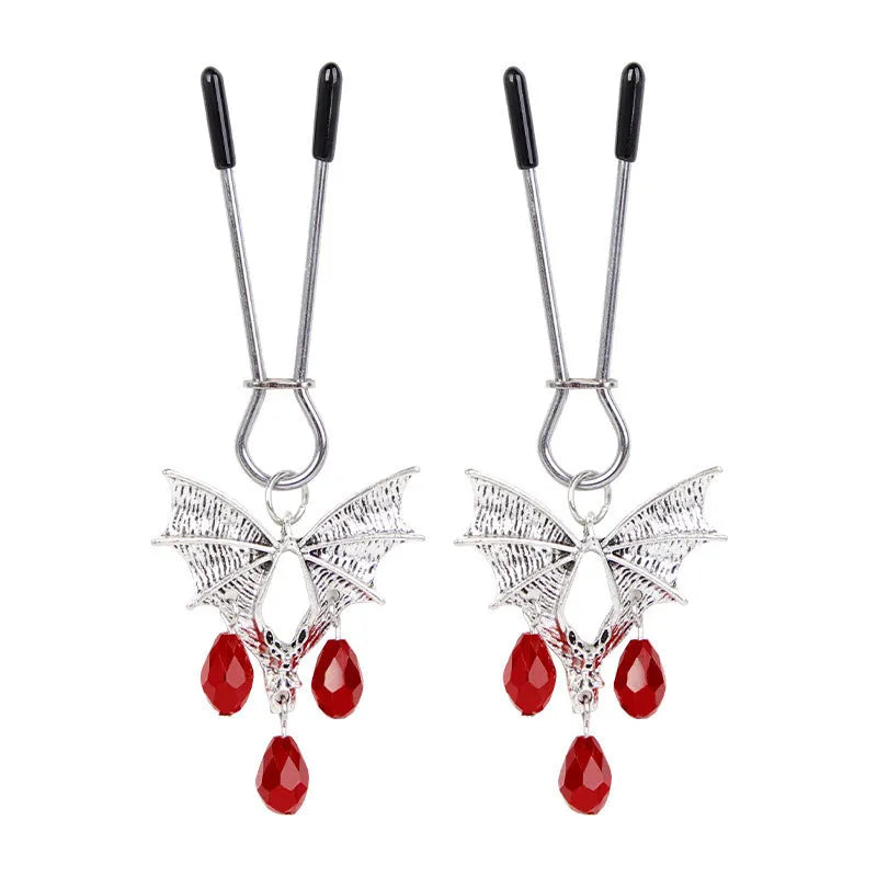 Silver alloy bat-themed nipple clamp with adjustable pressure and a red ruby decorative clip.