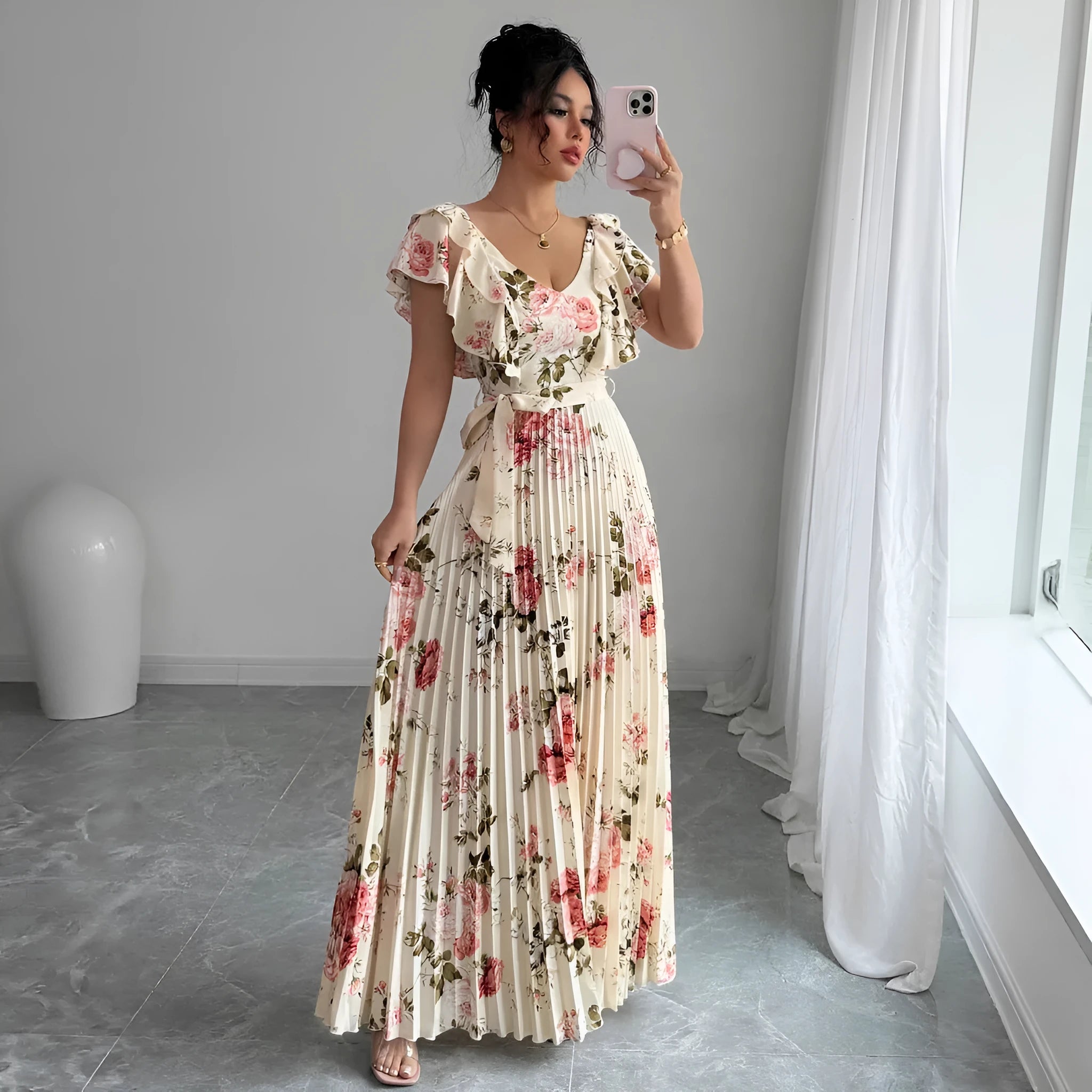 Apricot floral print V-neck dress with ruffled sleeves and a long, pleated swing skirt.