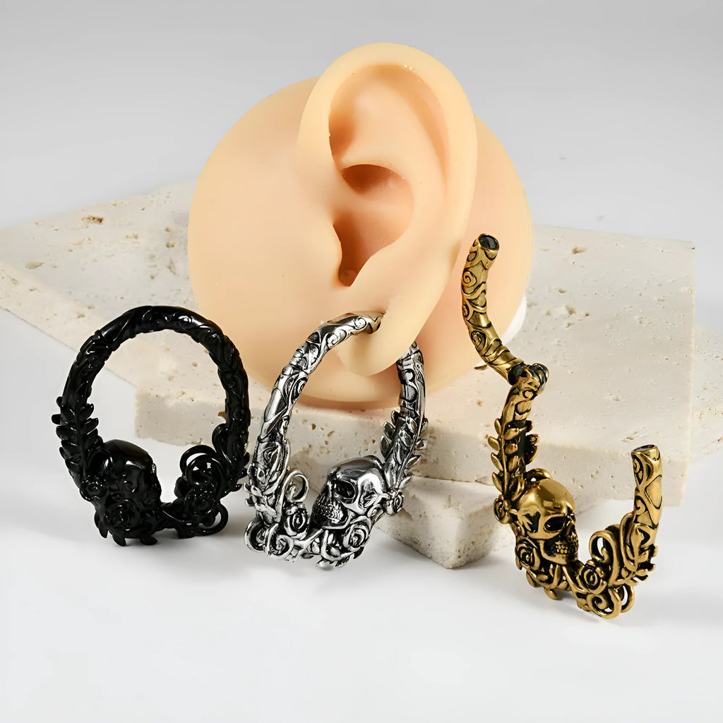 Stainless steel fashion earrings with a detailed totem pattern in an electroplated metallic finish