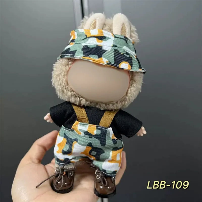 Plastic clothing outfit for a 17cm tall vinyl figure or doll on a display stand.