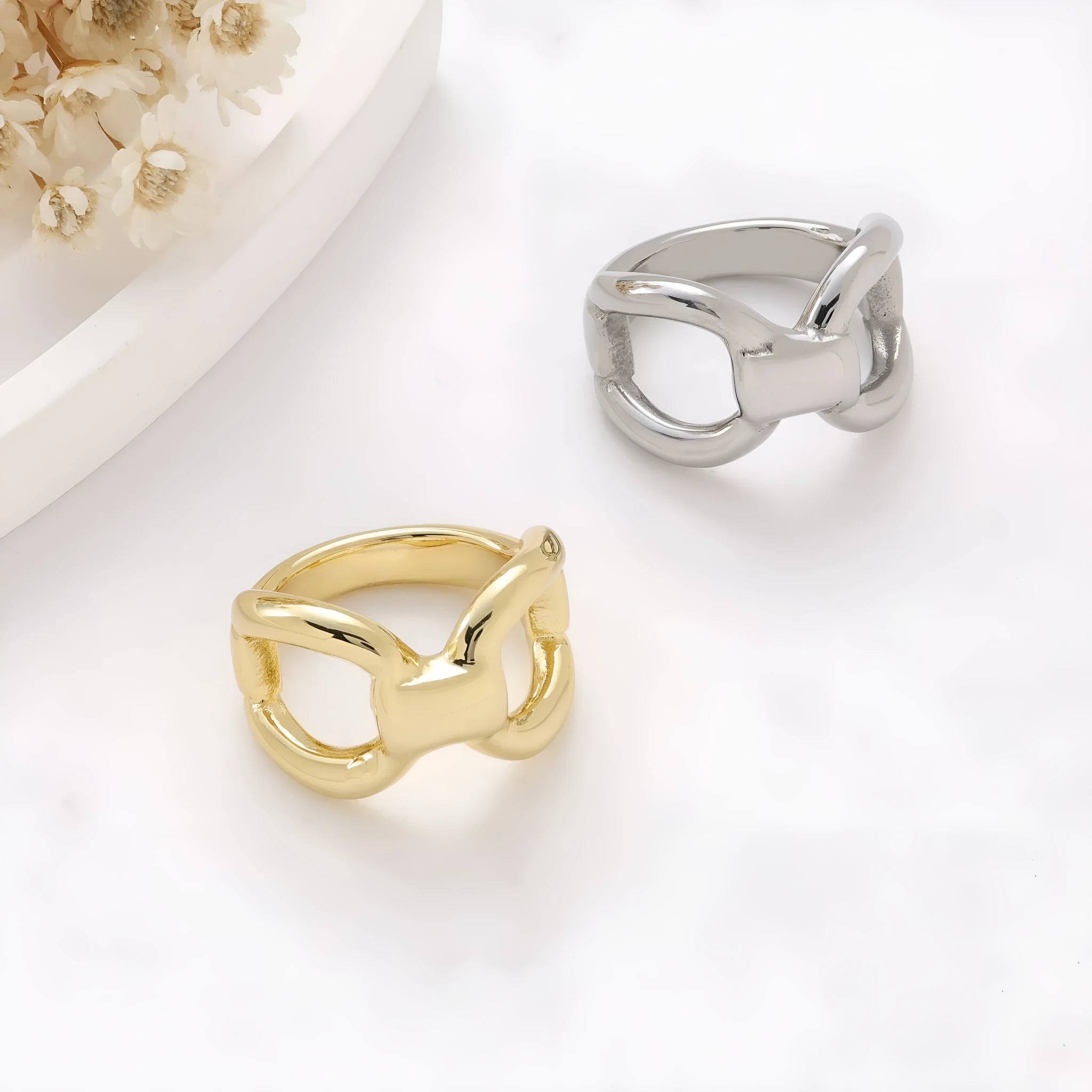 Titanium steel women's ring with hollow butterfly design and geometric bow shape in gold and steel colours